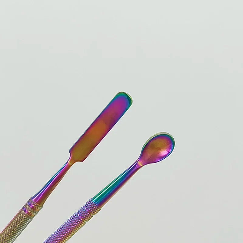 A close-up of a colorful stainless steel clay sculpting tool set featuring two elongated tools.
