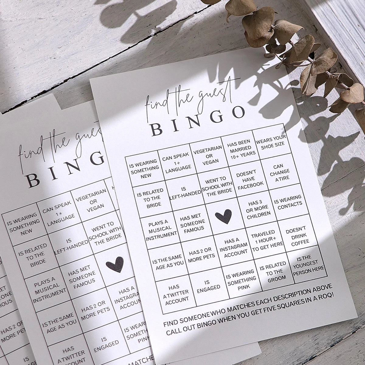 A game card titled Find the Guest Bingo featuring a grid of bingo squares for a bridal shower game
