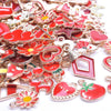 Assortment of gold-tone enamel charms featuring red and pink hearts, flowers, and geometric shapes for jewelry making