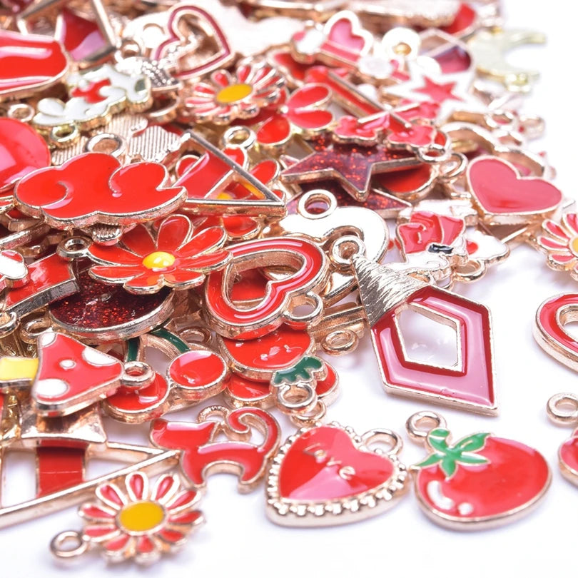 Assortment of gold-tone enamel charms featuring red and pink hearts, flowers, and geometric shapes for jewelry making