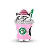 A silver cat-shaped charm bead with pink and green accents is displayed on a pink cup.