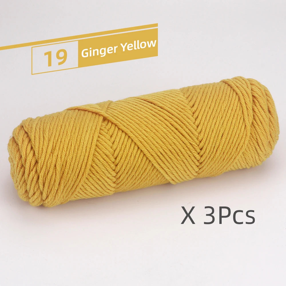 A skein of 19 Ginger Yellow soft cotton blend yarn for knitting and crochet, packaged as a 3-pack.