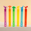 A row of colorful dinosaur-shaped bubble bottles in various shades of pink, orange, green, and blue.