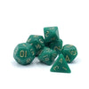 A set of seven small green polyhedral dice, including a d6 and a tetrahedron, are displayed on a white background.