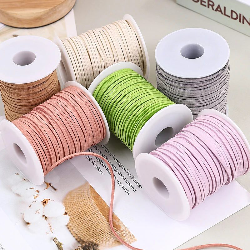 Rolls of pink, green, and gray velvet faux suede braided ribbon for crafting and gift wrapping