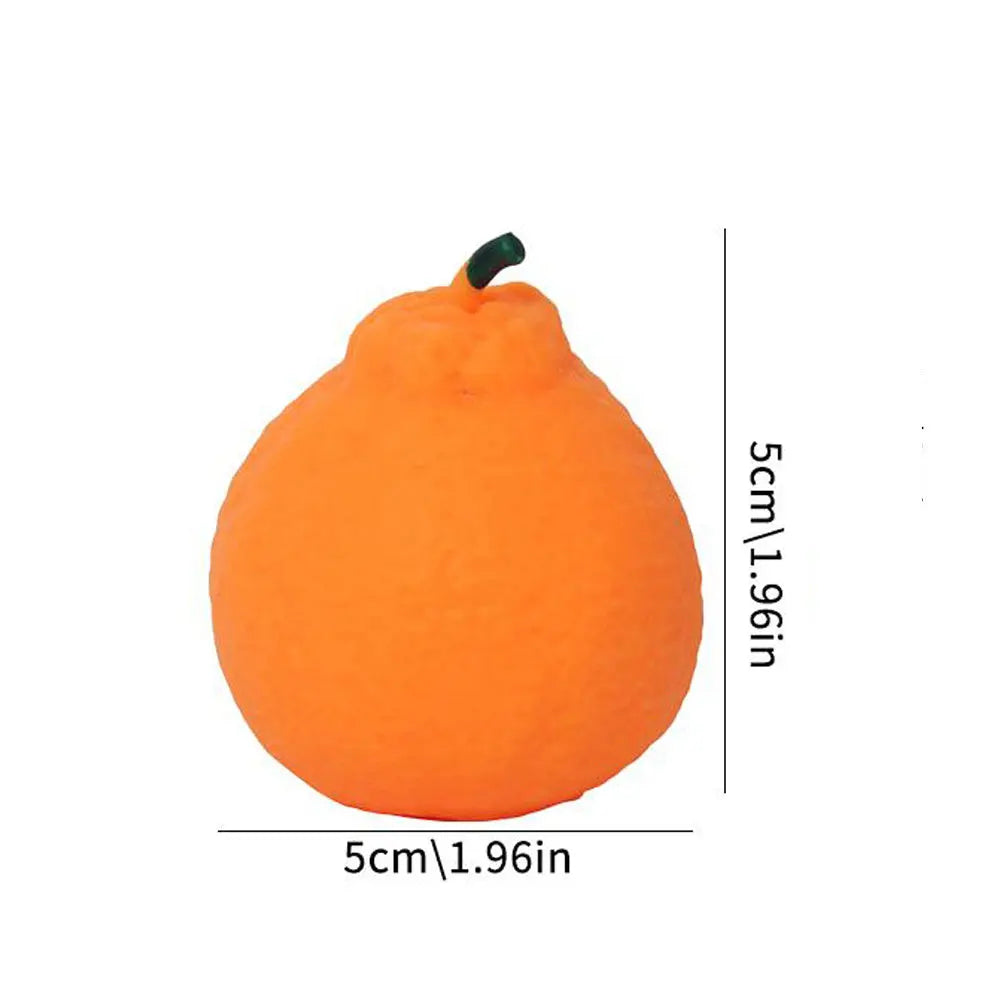 An orange dragon fruit squishy stress relief toy with a green stem.