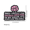 Black embroidered patch featuring a pink brain design with the text Once I defeat the chemical imbalance in my brain it's ove