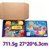 A box containing a squishy toy blind box with various colorful fruit-themed items and a yellow butter block.