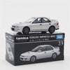 A silver Tomica Subaru Impreza WRX die-cast model car displayed in its packaging box.
