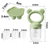 A silicone baby fruit feeder set showing a green silicone tray, molds, and a clear container with a lid.