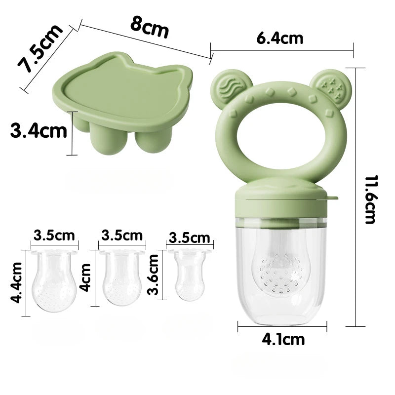 A silicone baby fruit feeder set showing a green silicone tray, molds, and a clear container with a lid.