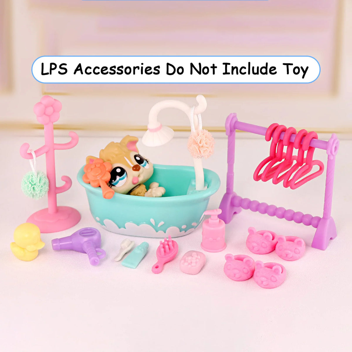 A set of LPS accessories including a bath, grooming tools, and drying rack for pet spa play.