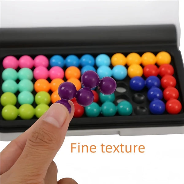A hand is shown placing colorful beads into a black tray for a logic puzzle.