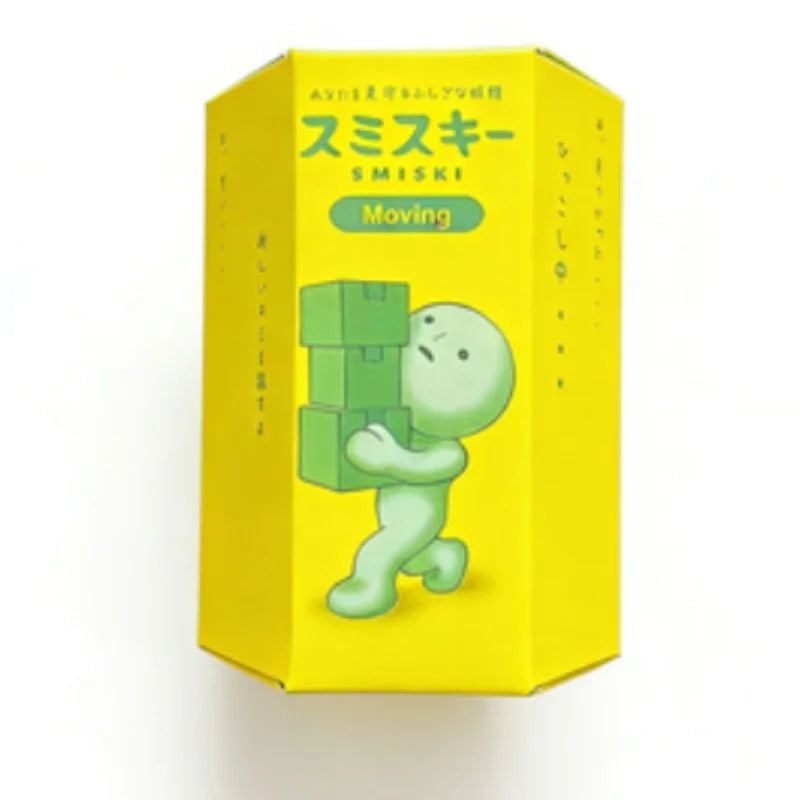 A yellow box for a Smiski Moving collectible featuring a green, blob-like figure.