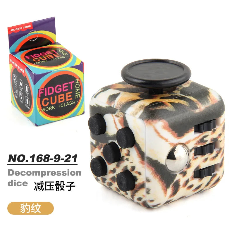 A black fidget cube with a leopard print design and multiple buttons is shown next to its packaging.