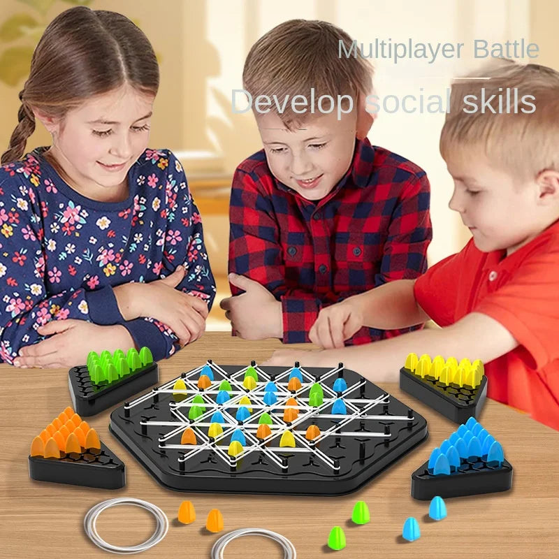 A family plays a triangle chess strategy board game with various colored pieces on a wooden table.