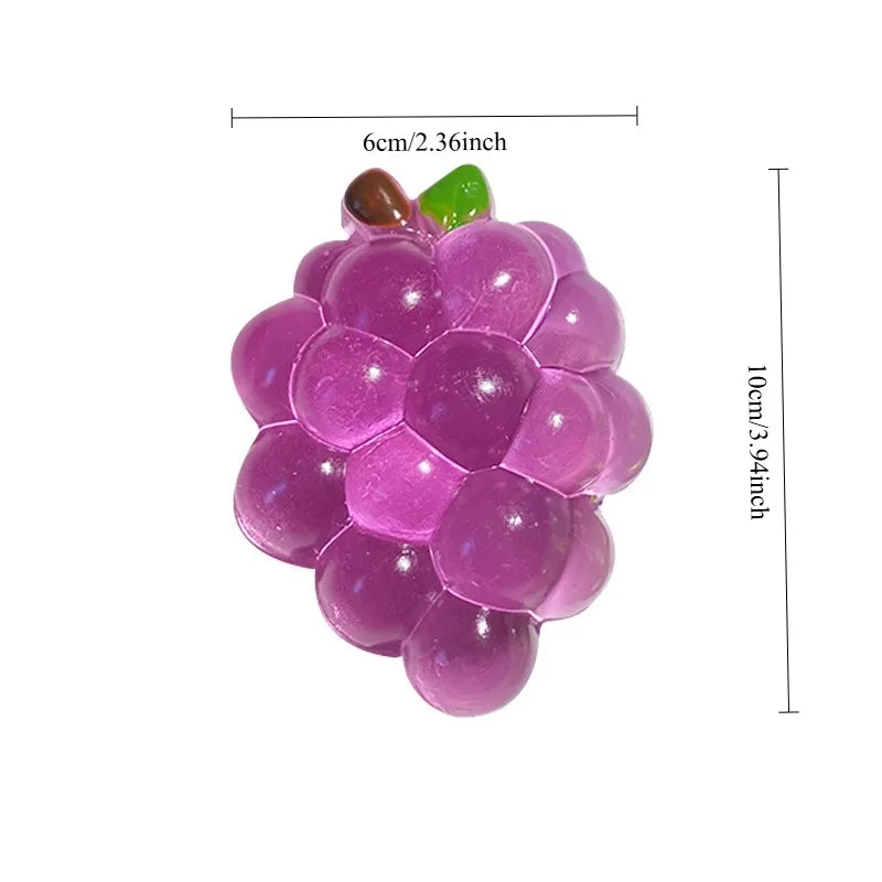 A purple squishy grape fidget toy with green leaves, measuring 6cm long.
