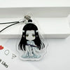 A clear acrylic pendant featuring an illustration of a character with long black hair and white clothing.