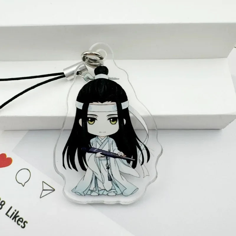 A clear acrylic pendant featuring an illustration of a character with long black hair and white clothing.