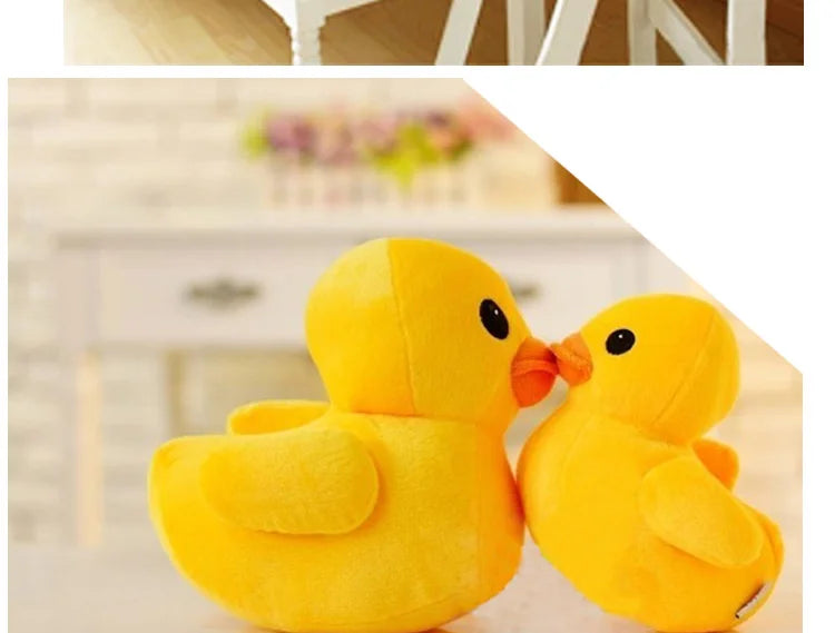 A close-up of two adorable yellow duck plush toys sitting together.