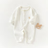 A white, ribbed soft cotton baby romper for newborns and infants with a small embroidered detail.