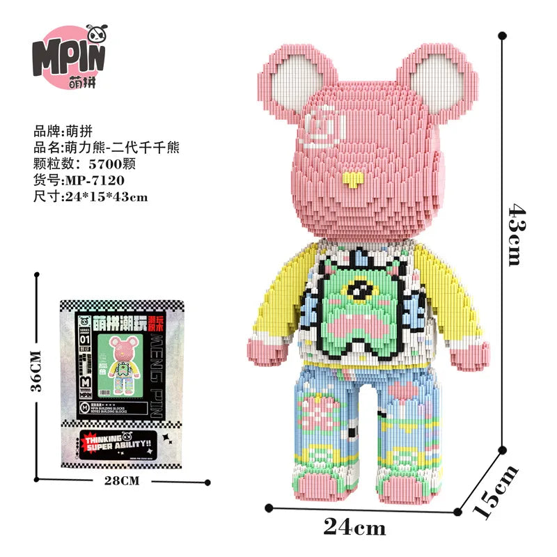 A pink bear figure made of micro building blocks with a yellow shirt and blue pants.