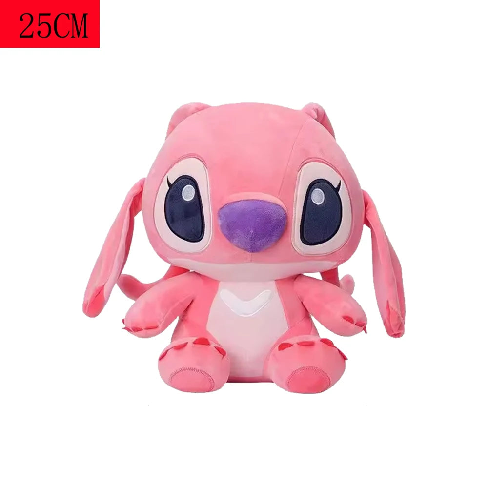 A pink plush figurine of a donkey character with large eyes and purple accents.