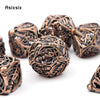 A set of coppery skull metal polyhedral dice used for tabletop role-playing games