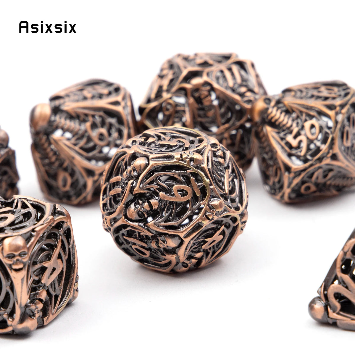 A set of coppery skull metal polyhedral dice used for tabletop role-playing games