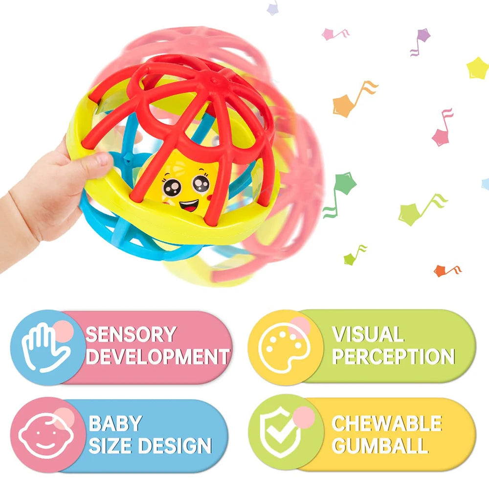 A hand is holding a colorful sensory developmental chewable gumball ball rattle designed for baby size.