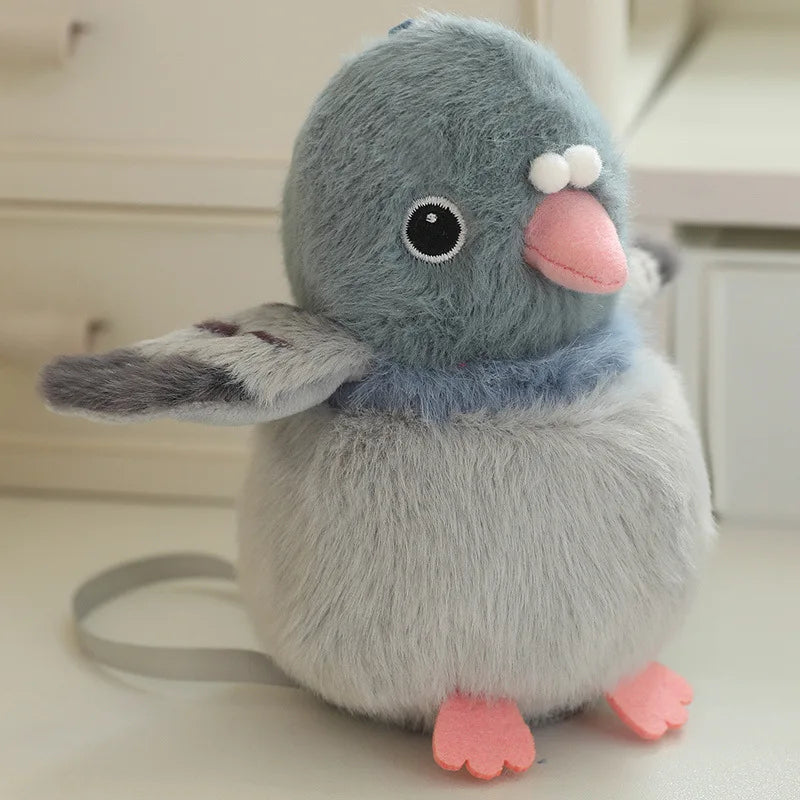 A soft gray cartoon bird plush with pink accents, designed as a keychain or pendant.
