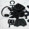 A black hoodie and matching shorts set for a doll, complete with headphones.