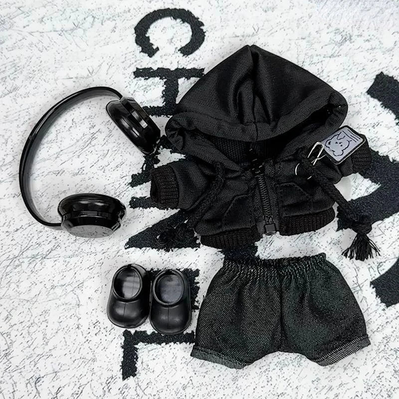 A black hoodie and matching shorts set for a doll, complete with headphones.
