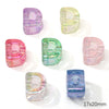 A collection of colorful acrylic alphabet beads in various shades including purple, green, pink, and blue.