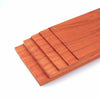 A rectangular board of natural African red rosewood with parallel grooves for DIY crafts.