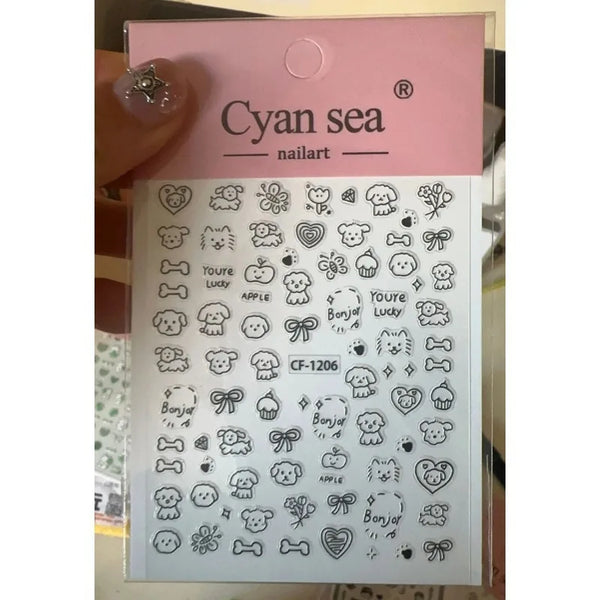 A sheet of Cyan sea nailart stickers featuring various cute dog and animal motifs for phone case decoration.