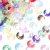 A collection of iridescent moon-shaped glass beads in various colors like pink, blue, green, and yellow.
