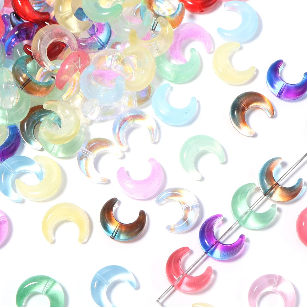 A collection of iridescent moon-shaped glass beads in various colors like pink, blue, green, and yellow.