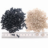 A collection of black and beige plastic safety eyes for amigurumi, including small threaded components.