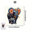 A wooden jigsaw puzzle of an elephant with colorful floral decorations.