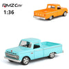 A light blue diecast model of a classic pickup truck in 1:36 scale.