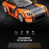 An orange and black sports car model built from building blocks, showcasing the technology of inheriting sports car genes.