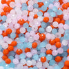 Mixed color faceted rondelle glass beads in shades of orange, pink, and blue for jewelry making