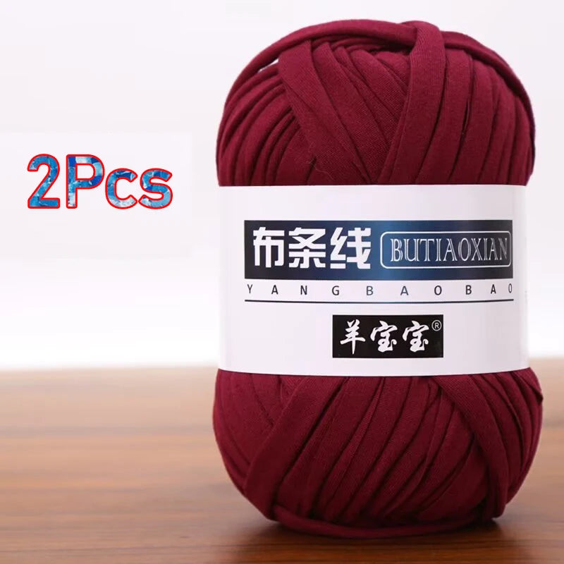 Two skeins of burgundy yarn labeled as Butiaoxian soft chunky T-shirt yarn for crochet and knitting