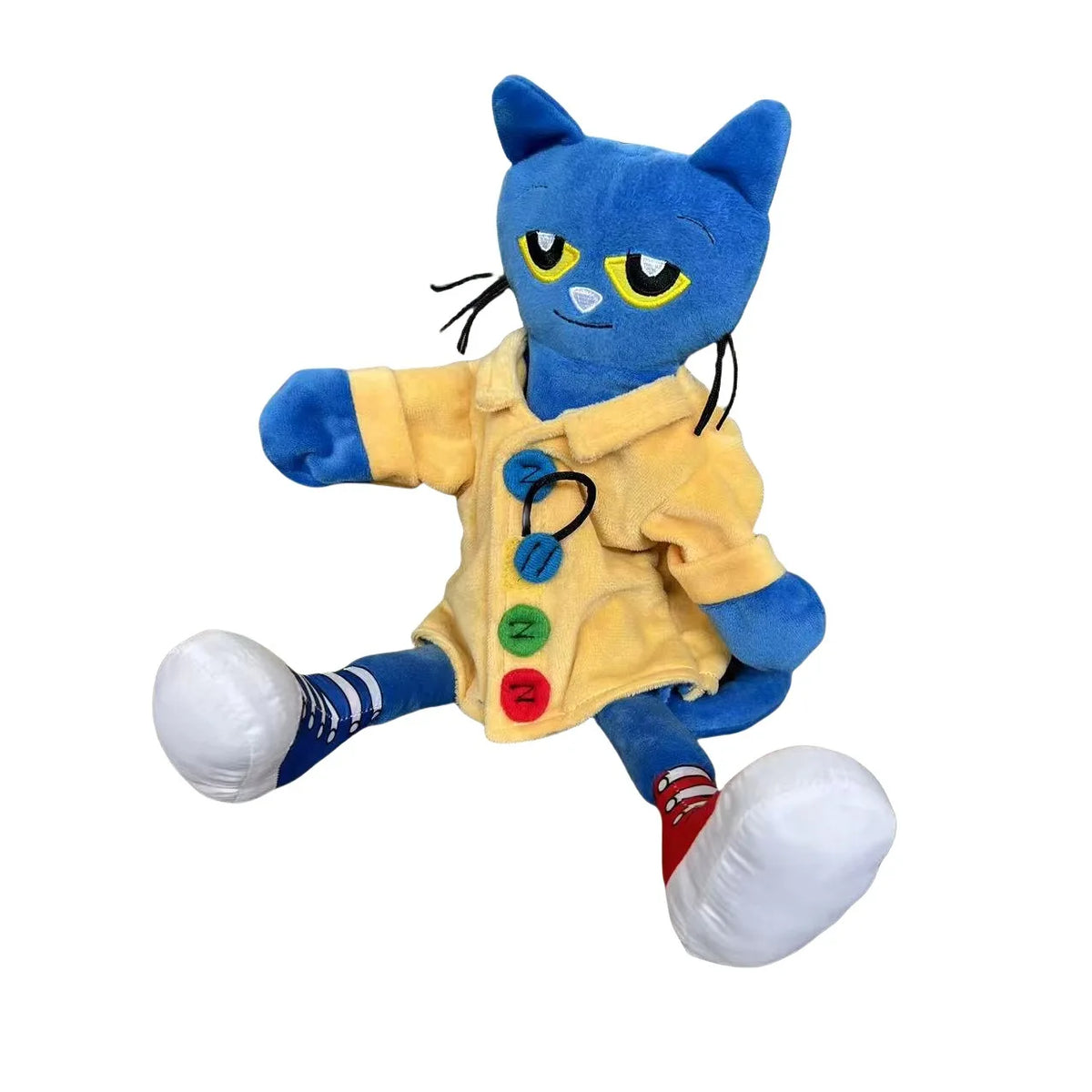 A blue cartoon cat plush toy with yellow clothing and white shoes.