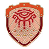 An enamel pin featuring a stylized eye design within a shield shape with geometric patterns.