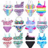 A collection of colorful girls' two-piece swimsuit sets featuring various patterns and colors.