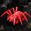 A red inertia-powered spider crawling toy car is shown on a dark, rocky surface.