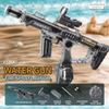 A silver water gun with a scope and barrel is shown against a blurred background, next to accessories like a battery and stra
