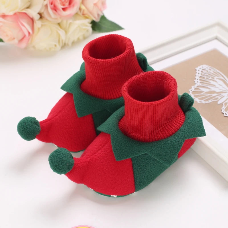 Pair of red and green animal-themed baby first walker shoes with knitted texture